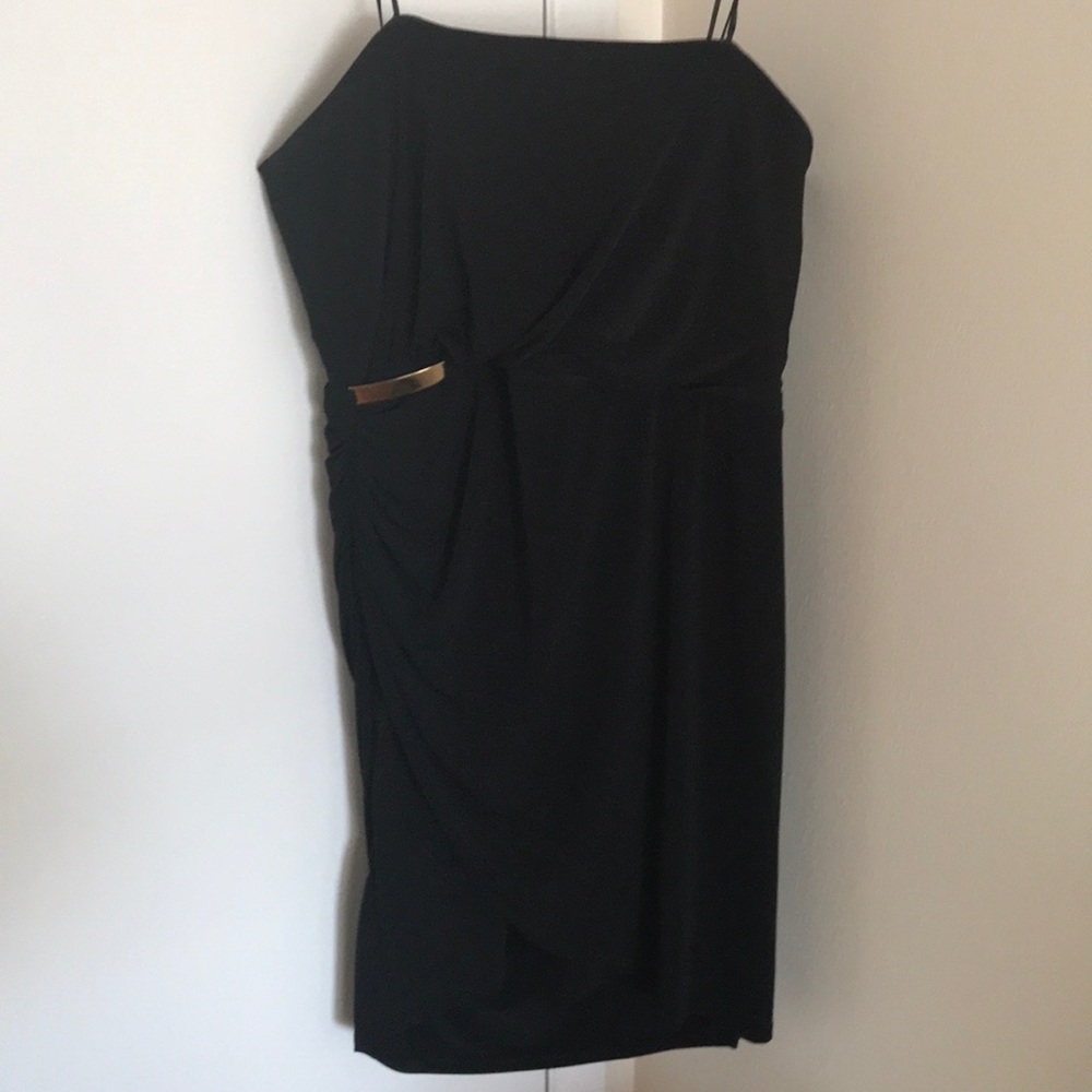 Strapless LBD with gold bar detail.